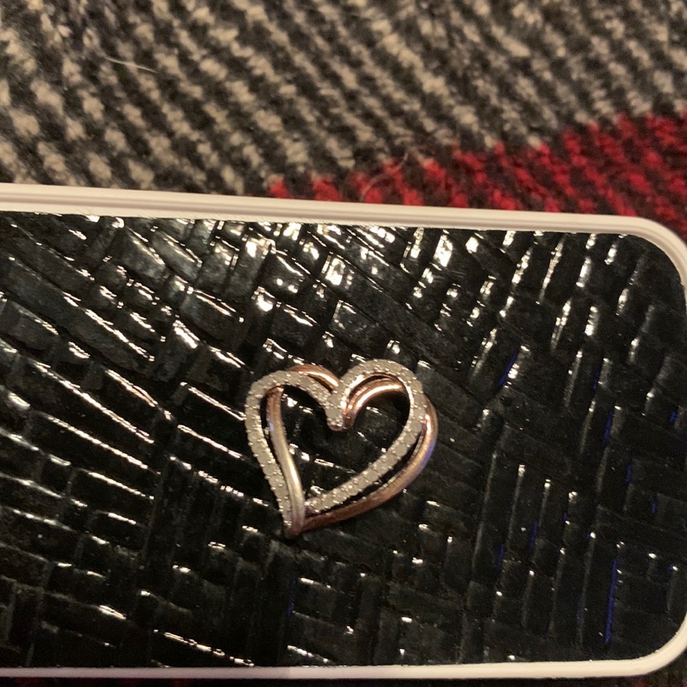 Silver and diamond double heart pendant.